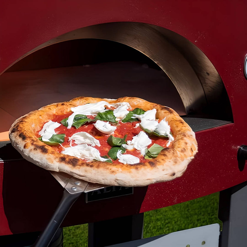 Alfa Pizza Oven Tool Kit Large close up view of peel removing a cooked pizza