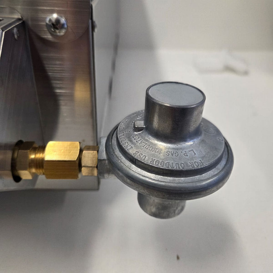 Quick-Connect Brass Fitting (3/8 SAE) & Disposable Bottle Regulator showing a closeup of the coleman disposable bottle regulator