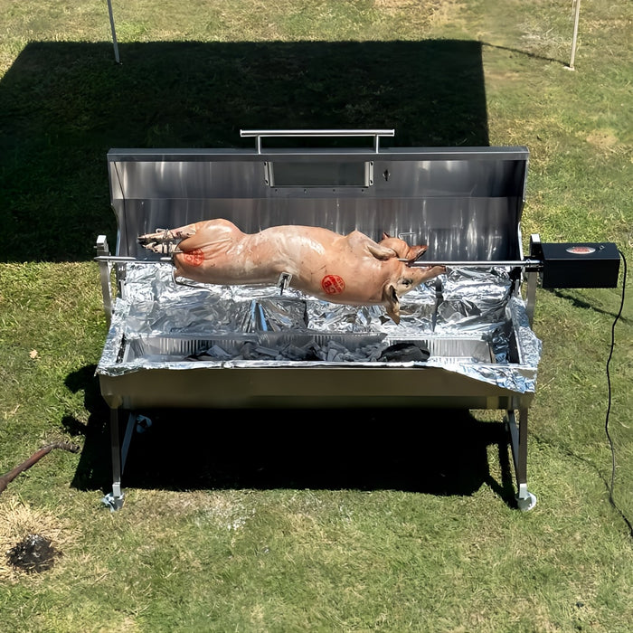 a whole lamb being cooked over charcoal on a 1500mm Spit Rotisserie