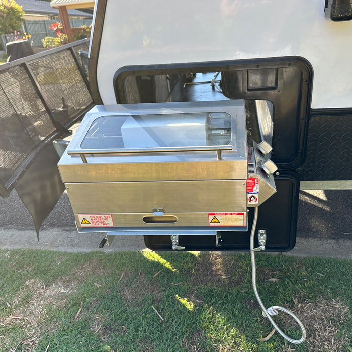 A sizzler deluxe on a caravan boot space slide