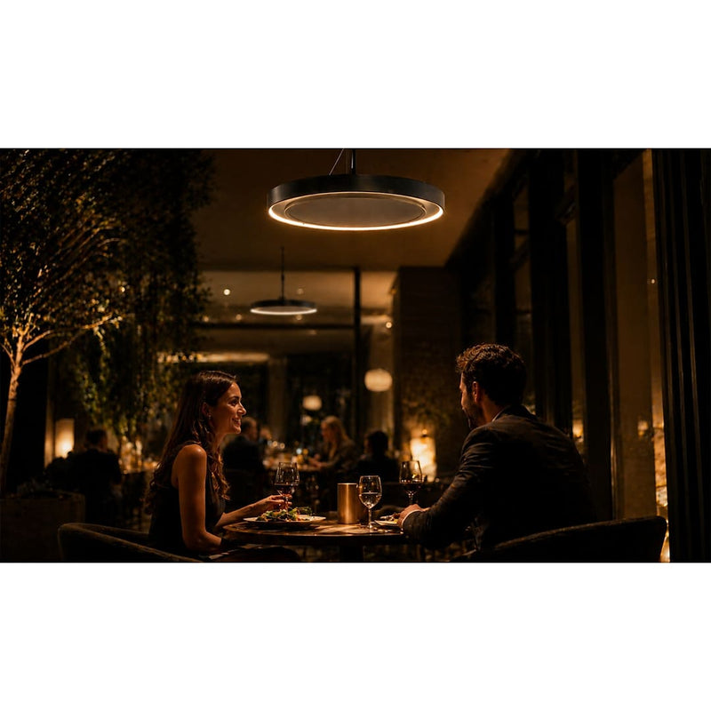 Herschel Ibiza Zero-Light Outdoor Infrared Heater with LED Lighting showing 2 people ina  restaraunt eating under one