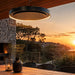 Herschel Ibiza Zero-Light Outdoor Infrared Heater with LED Lighting over an outdoor table