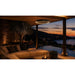 Herschel Ibiza Zero-Light Outdoor Infrared Heater with LED Lighting over an outdoor area showing a  pool
