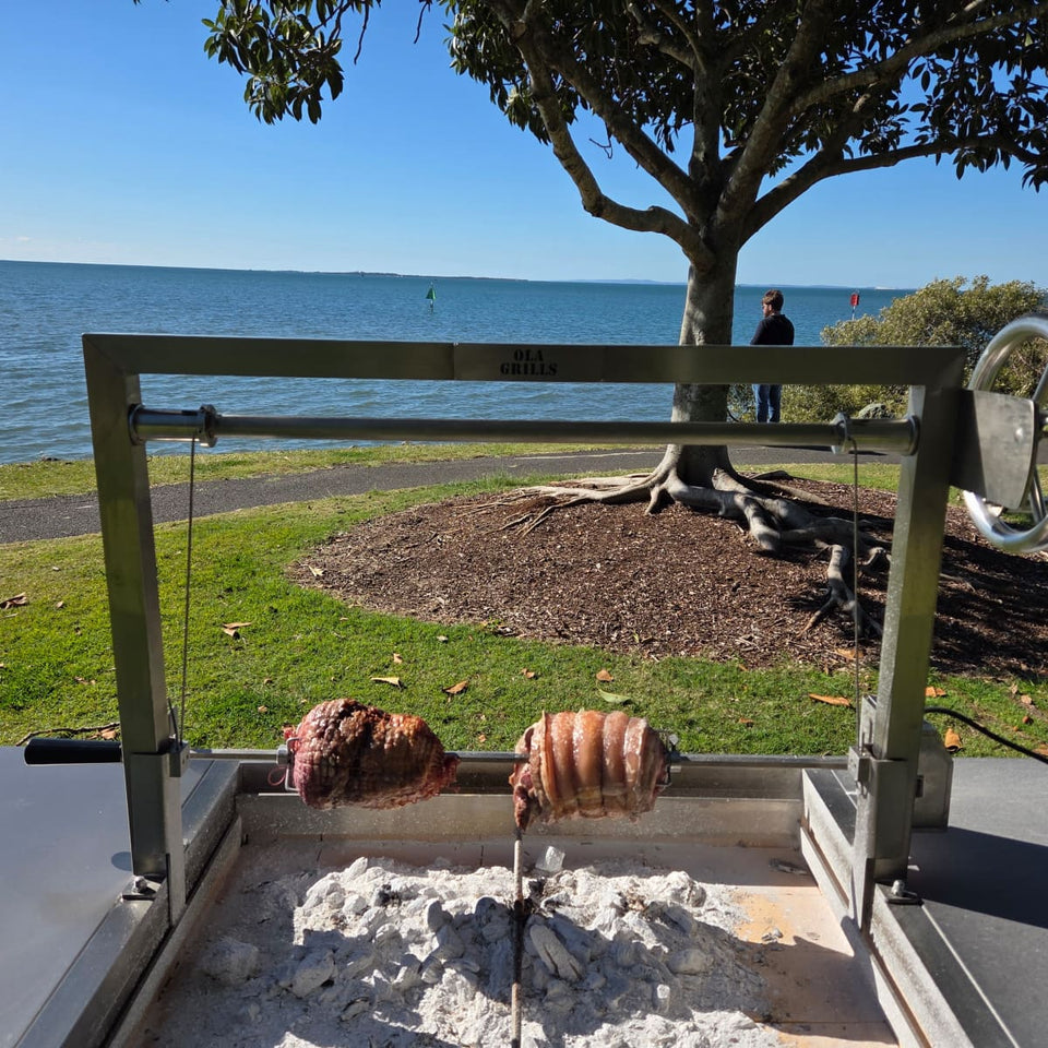 Rotisserie Kit For the OLA Grills Parrilla BBQ's | Multiple Models showing the rotissierie with meat on each prong