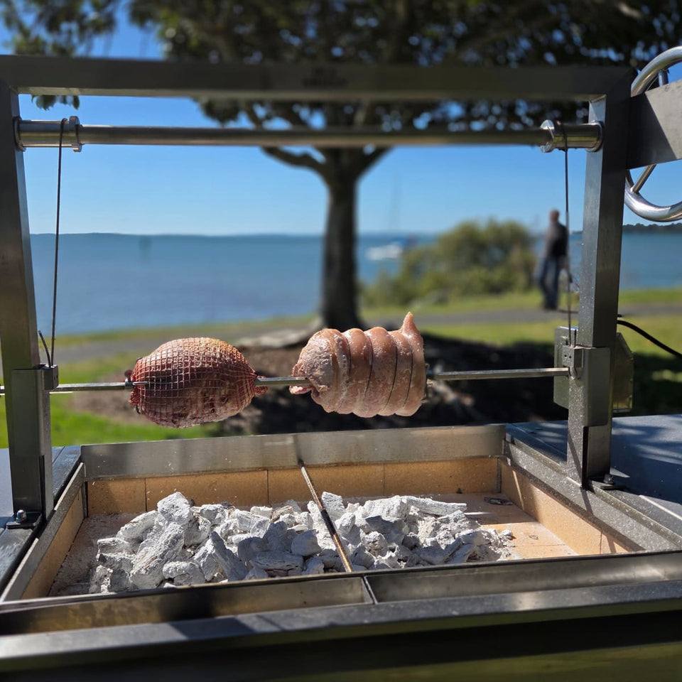 Rotisserie Kit For the OLA Grills Parrilla BBQ's | Multiple Models showing two rolled roasts cooking