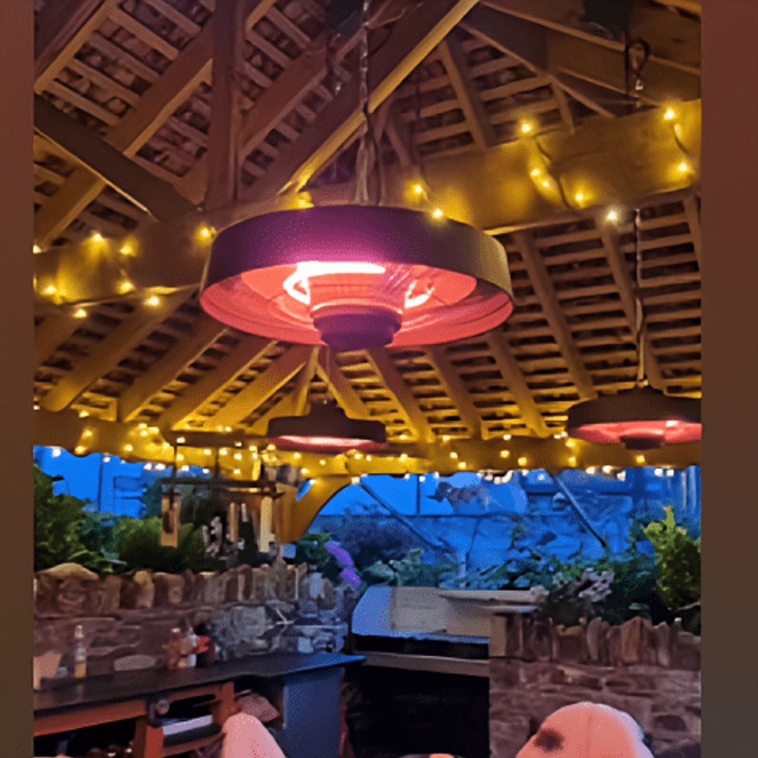 outdoor hanging infrared heater by outdoor living australia in a pergola area