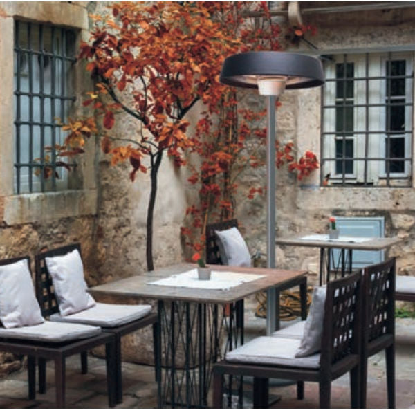 an outdoor herschel infrared heater on a stand in an outdoor area