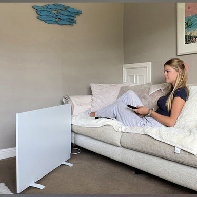 Infrared Heater | Electric | Herschel Select Portable 500W lady on couch next to heater