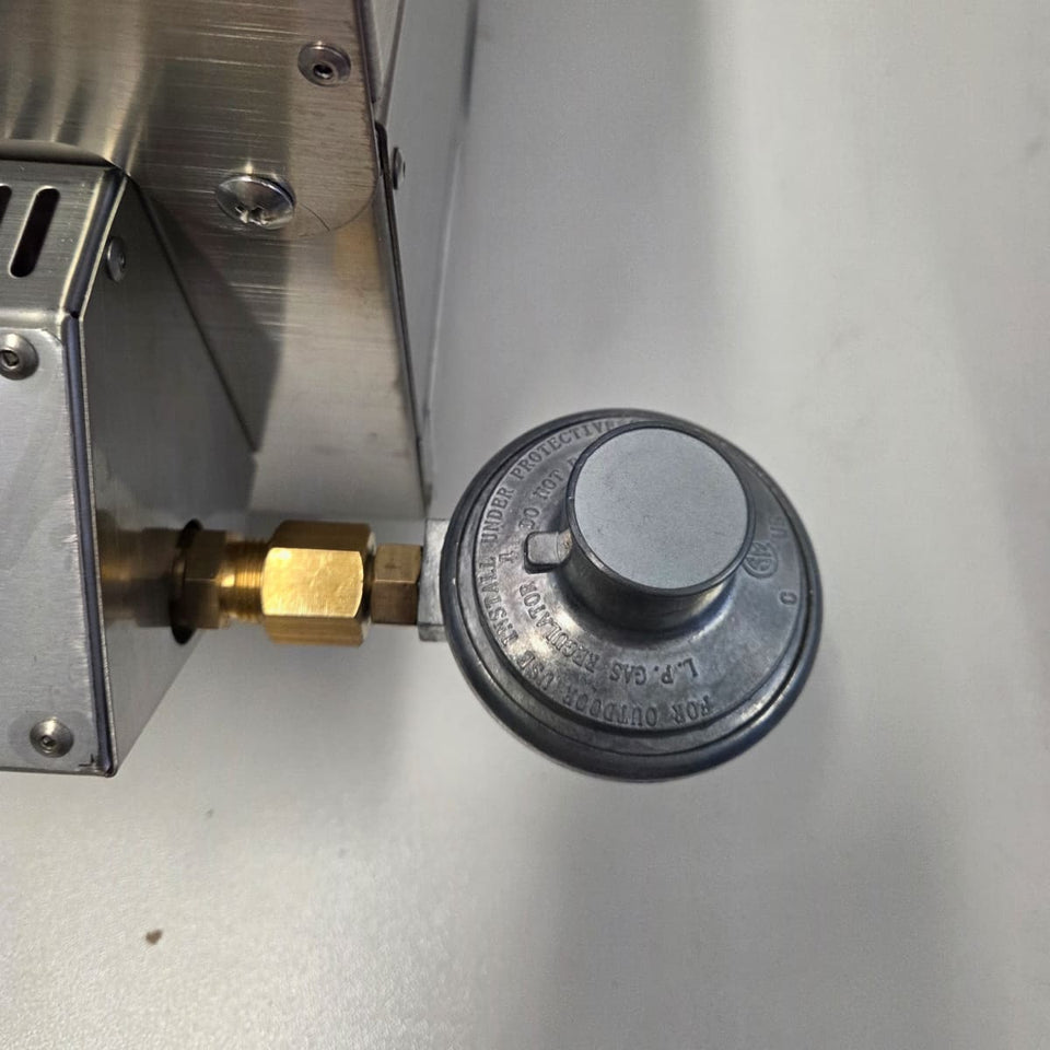 Quick-Connect Brass Fitting (3/8 SAE) & Disposable Bottle Regulatorshowing the disposable bottle regulator on the unit