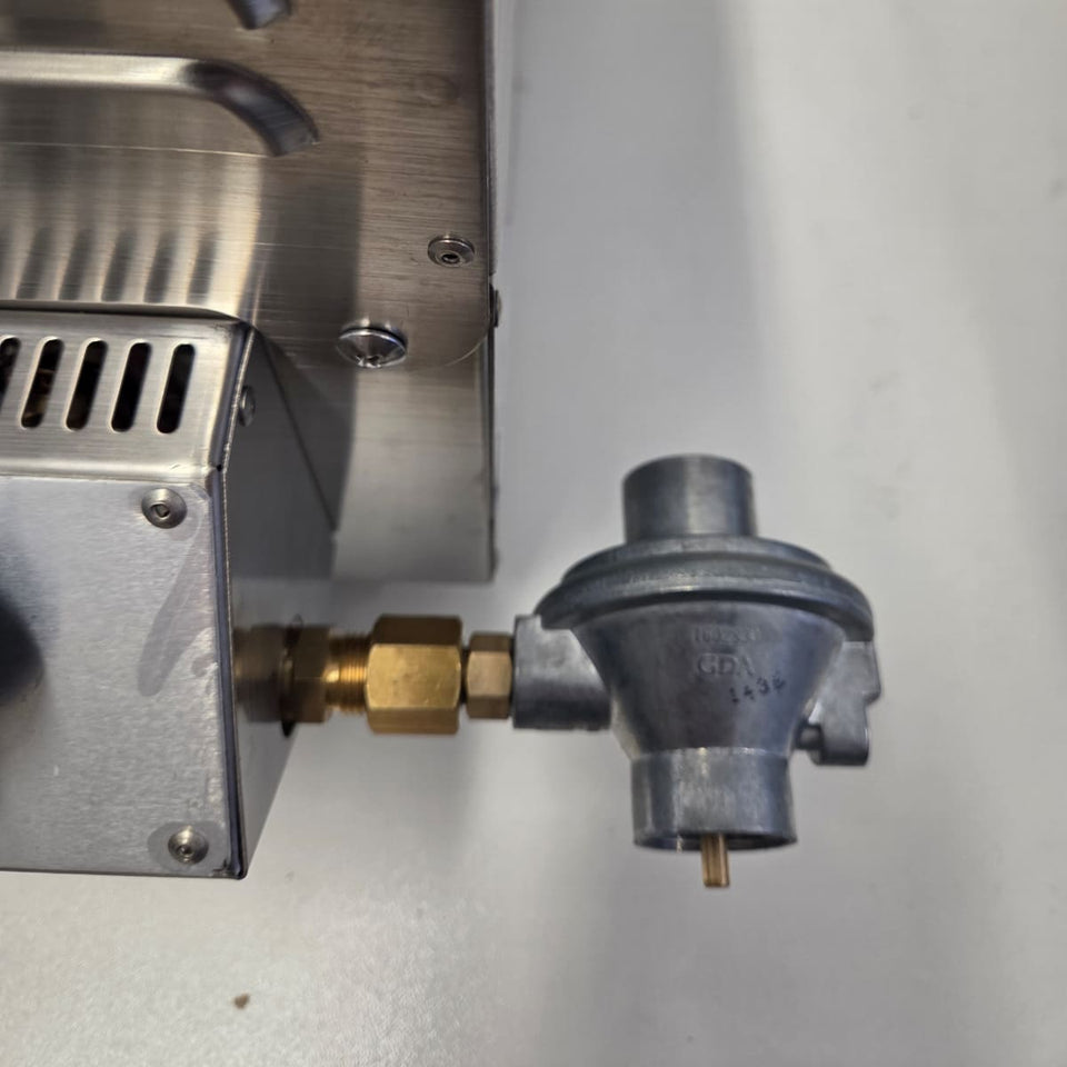 Quick-Connect Brass Fitting (3/8 SAE) & Disposable Bottle Regulator showing the disposable bottle regulator on the unit