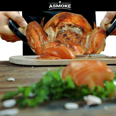 Person using claws to lift up a smoked chicken