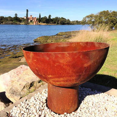 Fire Pit: The Goblet Of Fire in cast iron near river close up and laying flat